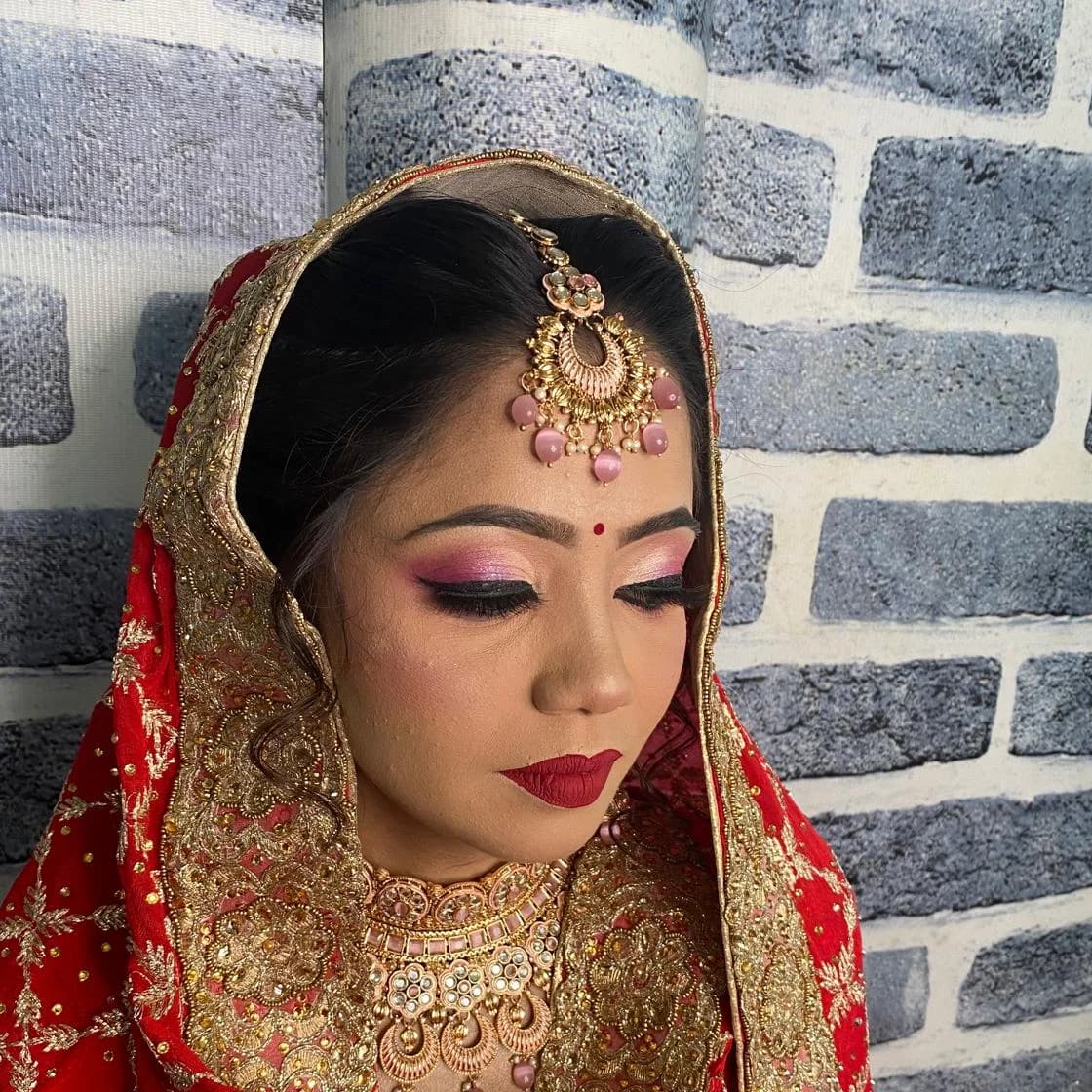 Real Aaina bride — red and gold
