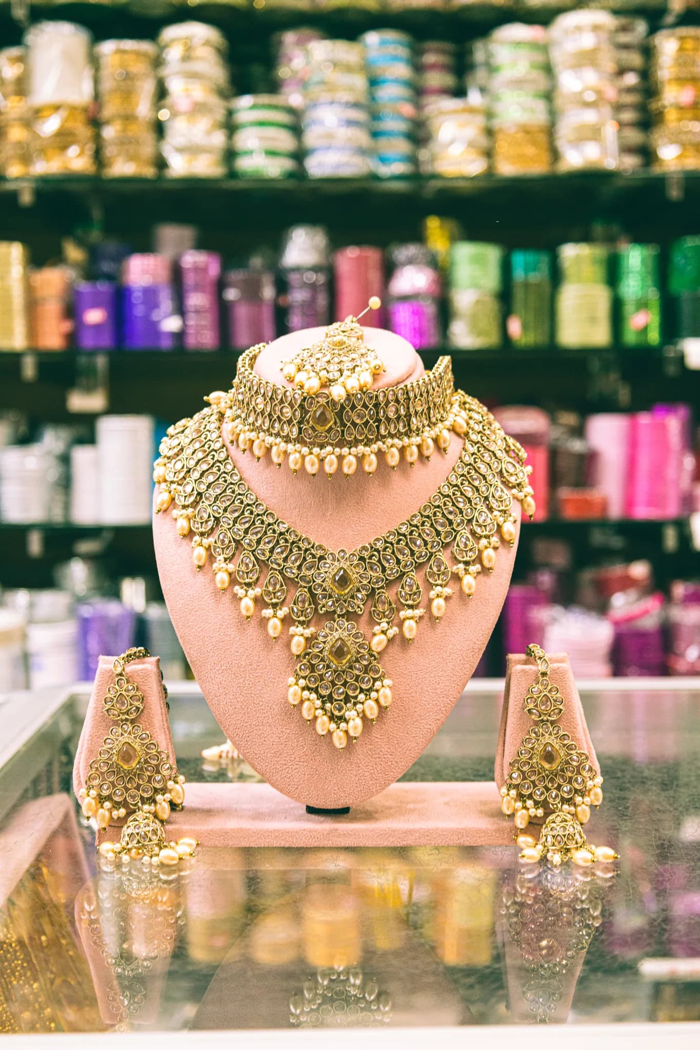 Styled jewellery on model — gold on skin