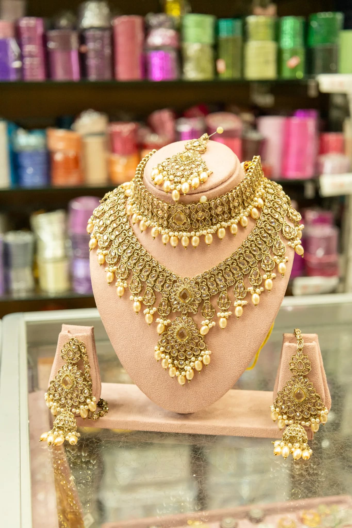 Gold bridal jewellery set on display