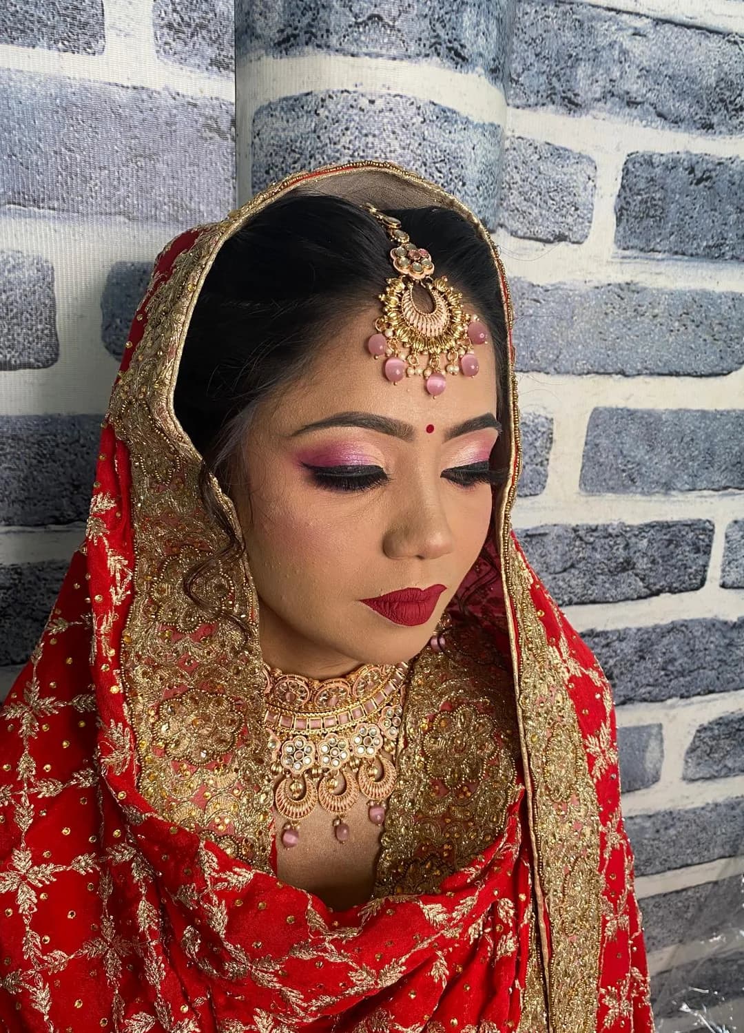 Real Aaina bride — arched hero portrait